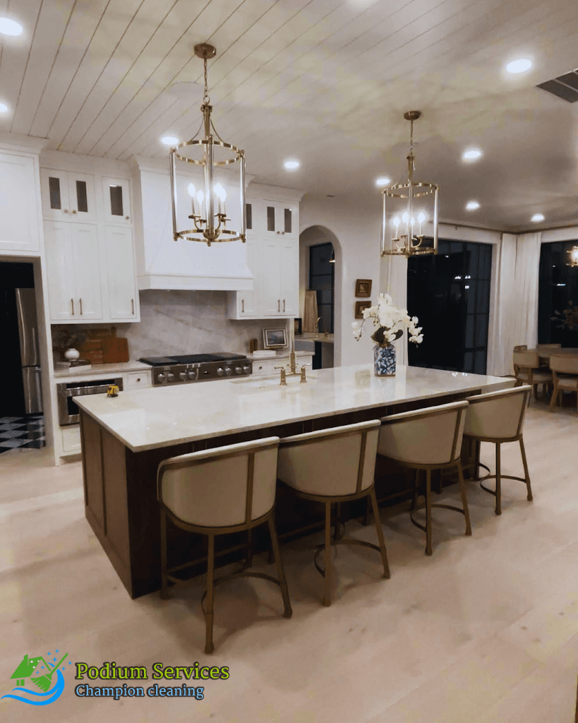 Spotless, staged kitchen with island after a Podium Services cleaning